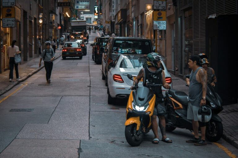 People and scooters on a city street